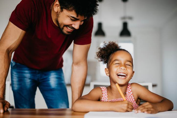 Family having fun while doing homework together